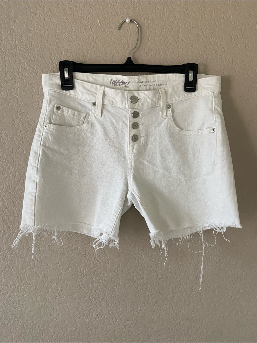 Mossimo Denim boyfriend shorts in white denim, button-fly with raw hem. Size 2